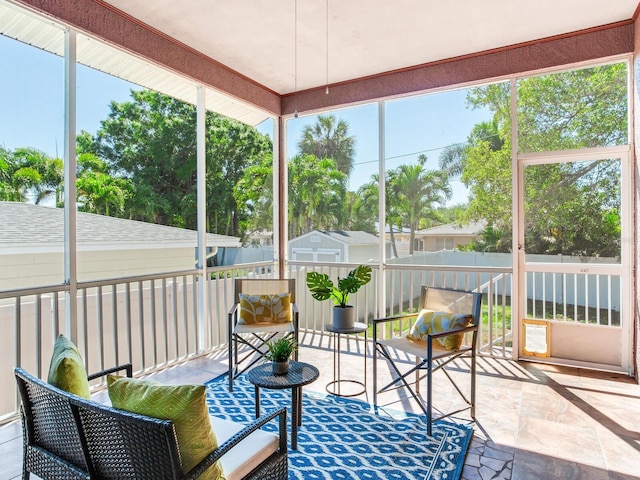 sunroom / solarium featuring a healthy amount of sunlight