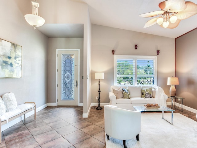 living room featuring tile patterned flooring, ceiling fan, and vaulted ceiling