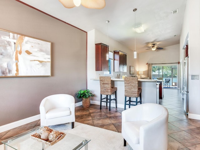 tiled living room featuring ceiling fan