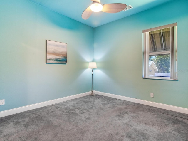 empty room featuring ceiling fan and carpet floors