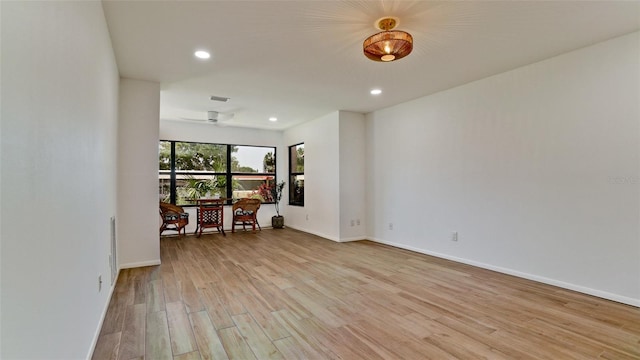 empty room featuring light hardwood / wood-style flooring and ceiling fan