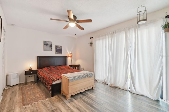 bedroom featuring hardwood / wood-style flooring and ceiling fan