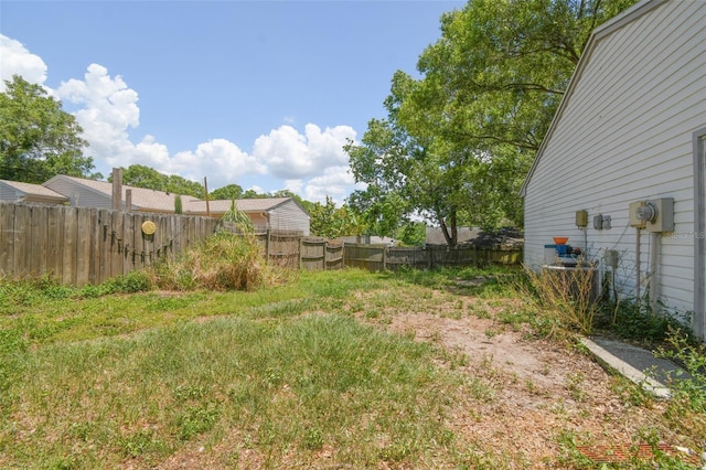 view of yard featuring central air condition unit