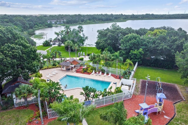 view of pool with a water view and a patio