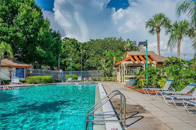 view of swimming pool with a patio area