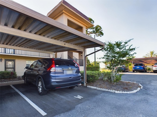 view of parking / parking lot with a carport