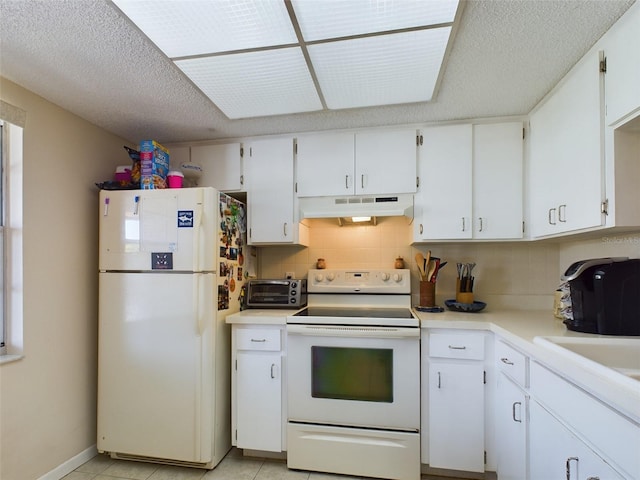 kitchen featuring light tile floors, a textured ceiling, white cabinets, white appliances, and tasteful backsplash