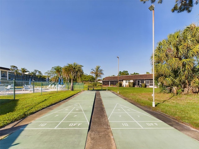 view of nearby features featuring a pool and a lawn