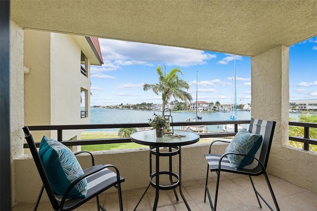 balcony featuring a water view