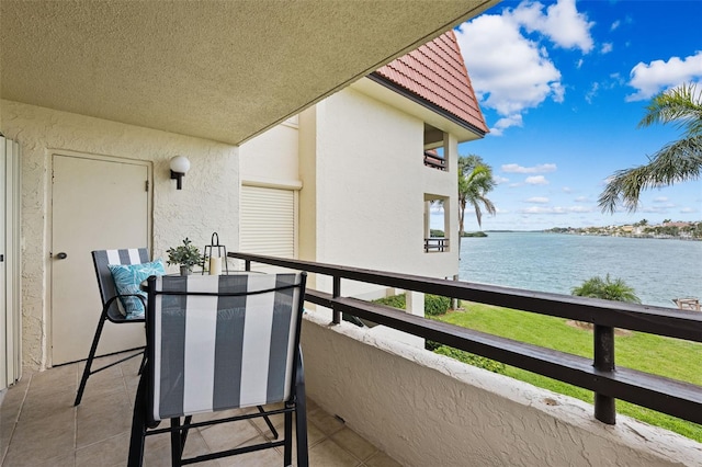 balcony featuring a water view