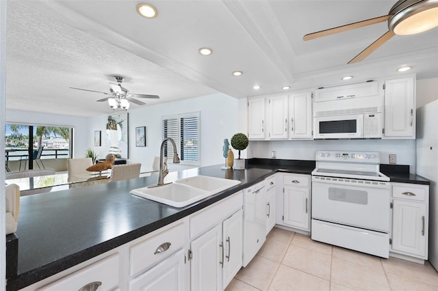 kitchen featuring light tile patterned flooring, white cabinets, white appliances, crown molding, and sink