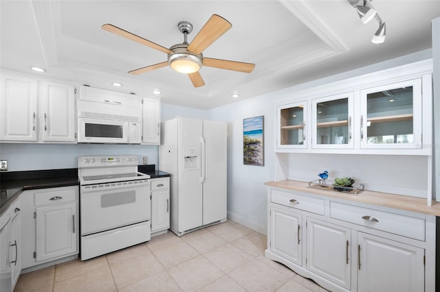 kitchen with white cabinets, white appliances, ceiling fan, and a tray ceiling