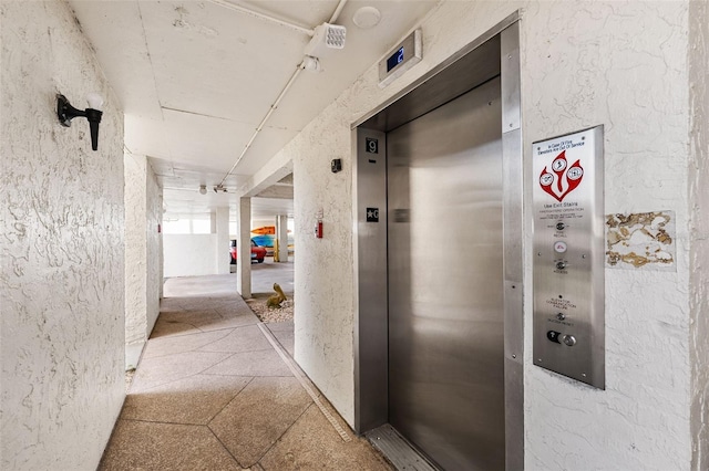 hallway featuring elevator