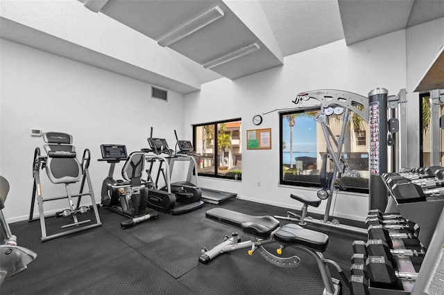 exercise room with a textured ceiling