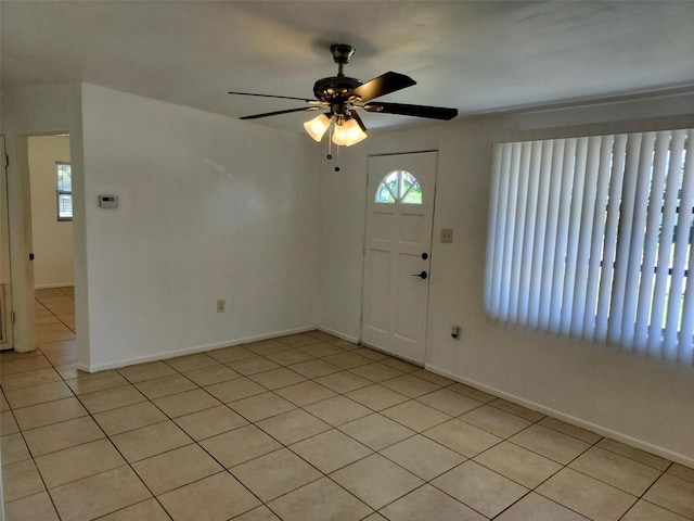 tiled foyer entrance featuring ceiling fan