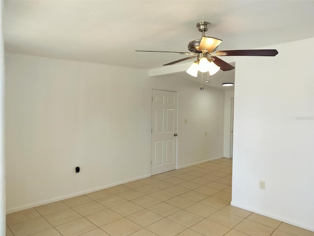 unfurnished room featuring ceiling fan and light tile patterned flooring