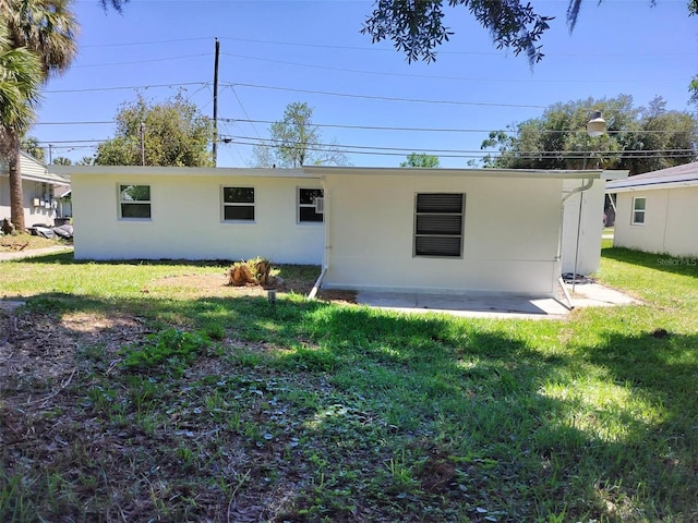 back of house with a yard