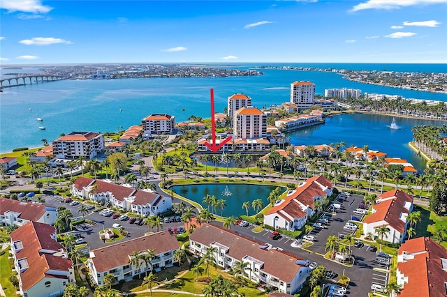 birds eye view of property featuring a water view