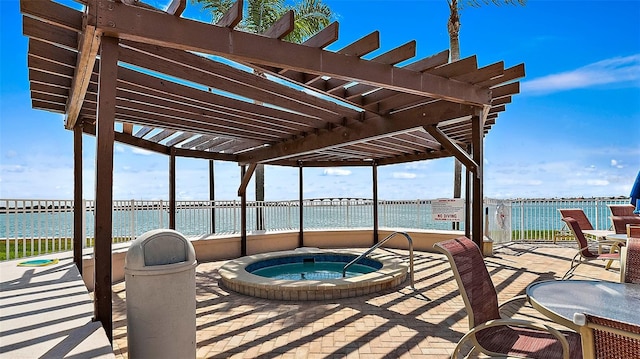 exterior space featuring a water view, a community hot tub, and a pergola