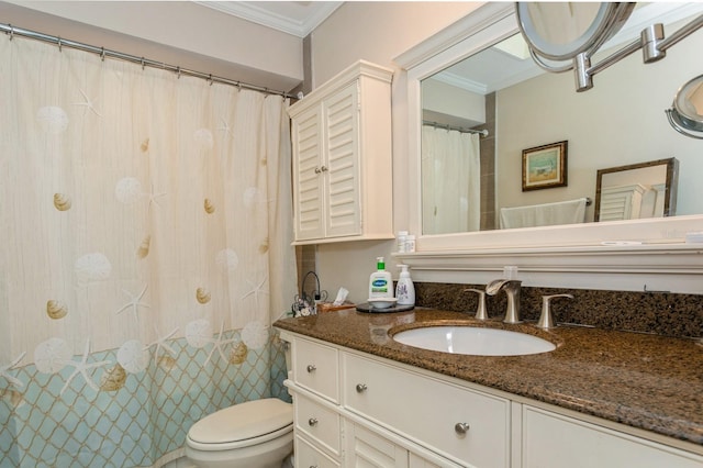 bathroom with ornamental molding, toilet, and vanity