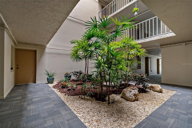 view of home's exterior featuring a patio and a balcony