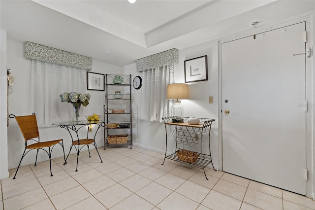 sitting room with light tile floors