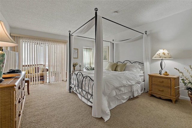 carpeted bedroom with a textured ceiling