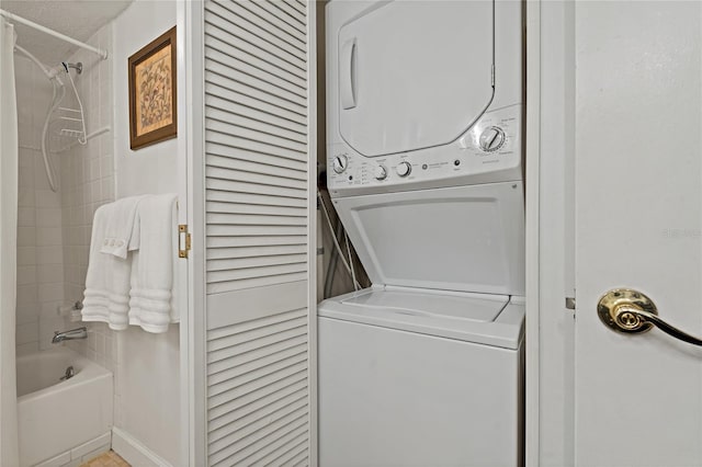 laundry room featuring stacked washer and clothes dryer