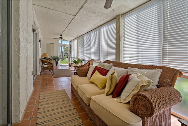 sunroom / solarium featuring ceiling fan