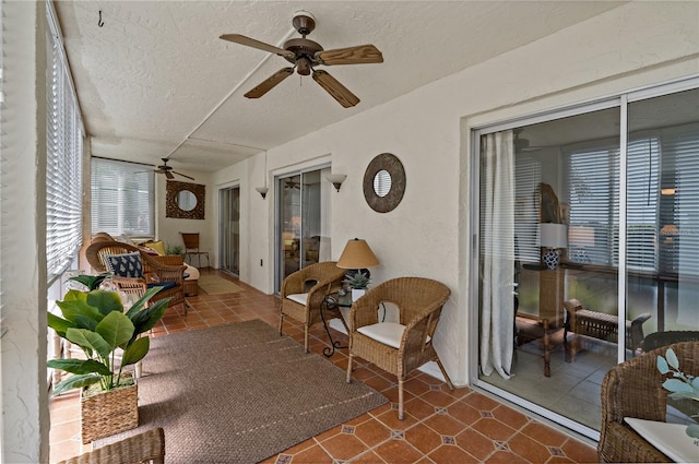 sunroom / solarium with ceiling fan