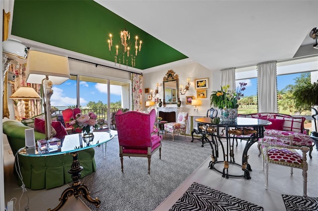 living room with a notable chandelier and crown molding