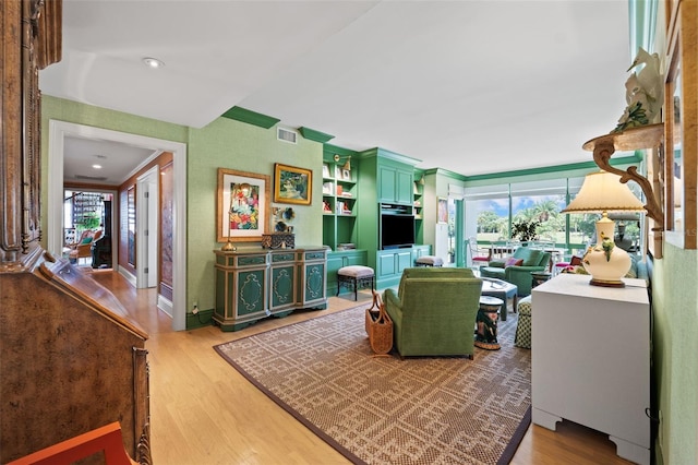 living room featuring plenty of natural light and light wood-type flooring