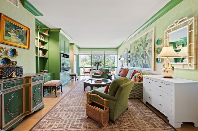 living room featuring wood-type flooring and ornamental molding