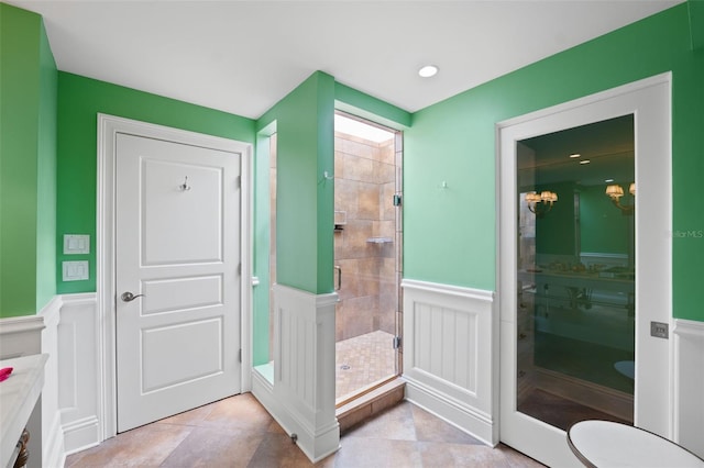 bathroom with tile floors and an enclosed shower