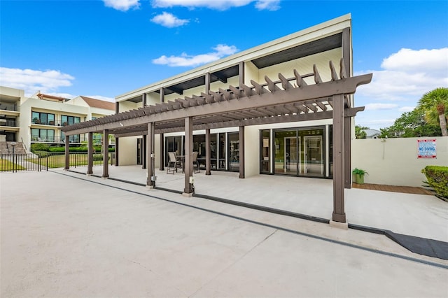 view of patio / terrace featuring a pergola and a balcony