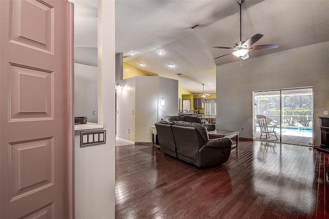 living room featuring high vaulted ceiling, ceiling fan, and dark hardwood / wood-style flooring