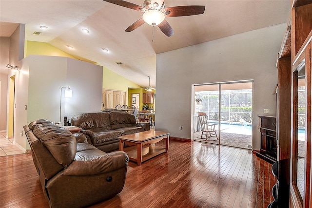 living room featuring high vaulted ceiling, ceiling fan, and hardwood / wood-style floors