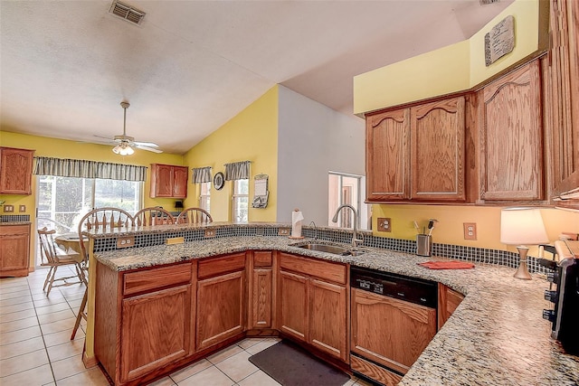 kitchen featuring lofted ceiling, kitchen peninsula, paneled dishwasher, sink, and light tile floors