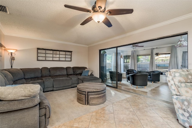 living room featuring crown molding, light tile patterned floors, ceiling fan, and a textured ceiling