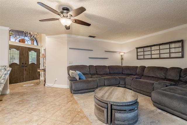 tiled living room with crown molding, ceiling fan, a textured ceiling, and french doors