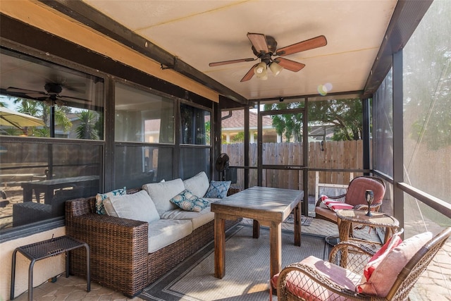 sunroom with ceiling fan and a healthy amount of sunlight