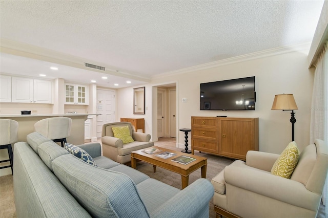 living room featuring a textured ceiling, light carpet, and ornamental molding