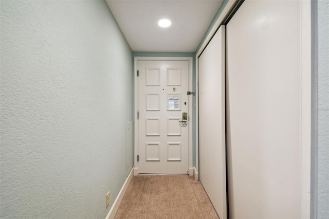 entryway with light carpet