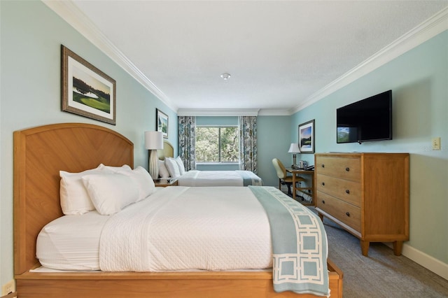 bedroom featuring crown molding and carpet