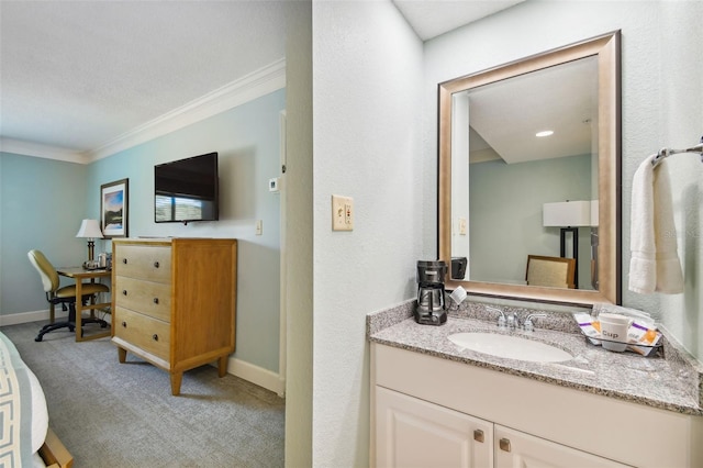 bathroom with vanity and ornamental molding