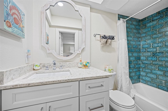 full bathroom with vanity, toilet, and shower / tub combo with curtain