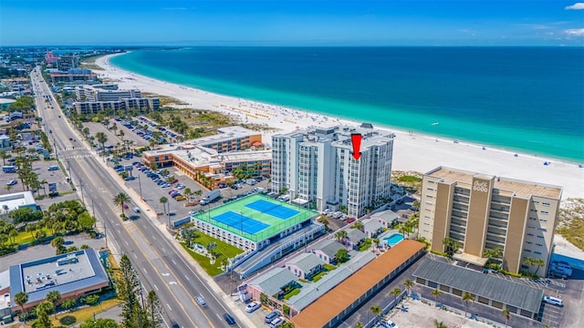 bird's eye view with a water view and a beach view