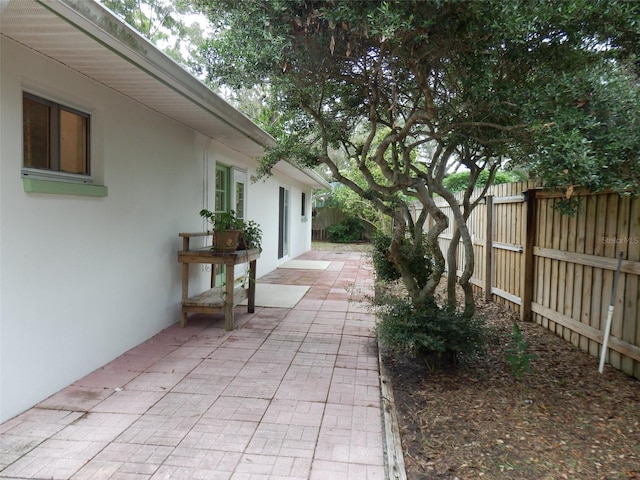 view of patio / terrace featuring fence