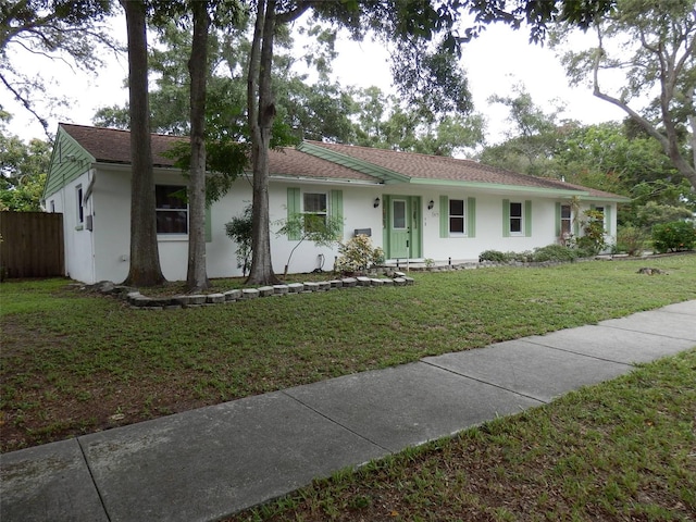 ranch-style house with a front lawn