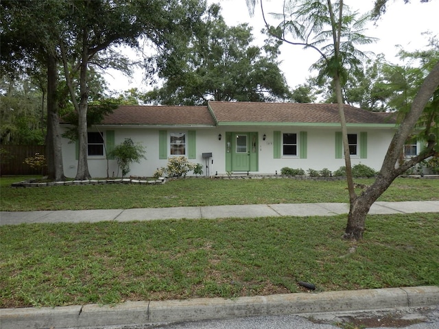 ranch-style home with a front yard